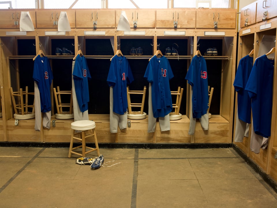 Team jerseys hanging in locker room